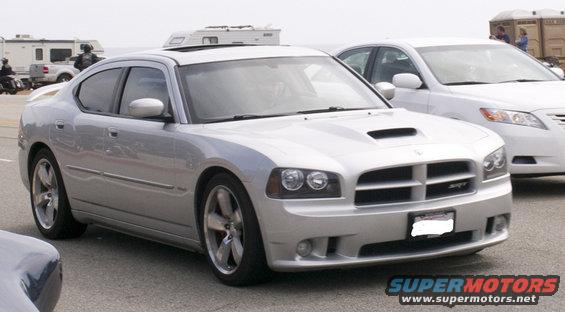 Silver Dodge Charger SRT8 with hood scoop and SRT badge