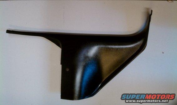 Black plastic interior trim piece with a curved edge and a flat extension
