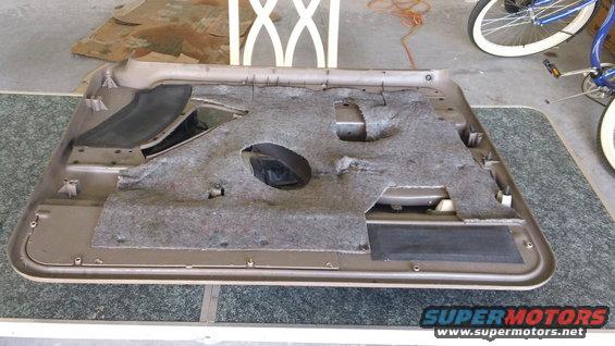 Car door panel with insulation and speaker cutout