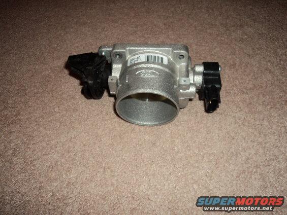 Ford throttle body with part number 208-42 printed on it