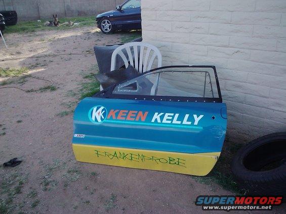 Blue and yellow car door with "KEEN KELLY" and "FRANKENPROBE" written on it
