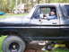 1978 Ford Bronco - Man gives thumbs up from the driver's seat of a black 1978 Ford Bronco.