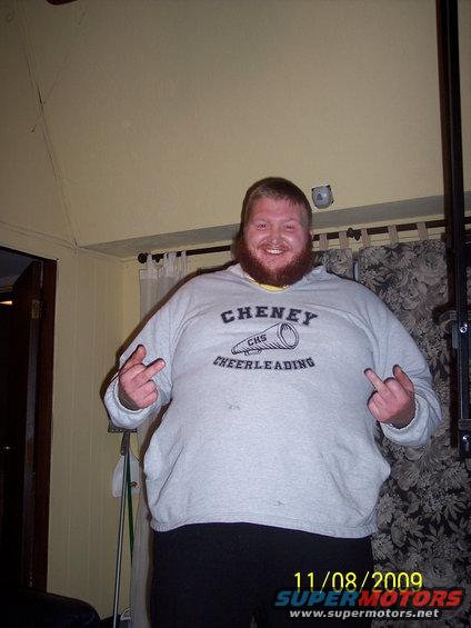 Man in Cheney Cheerleading sweatshirt giving the finger
