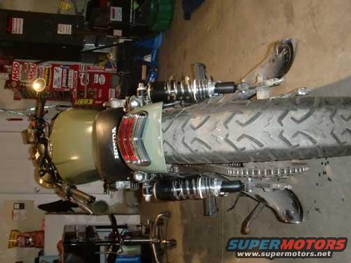 Motorcycle rear tire and fender with HONDA badge