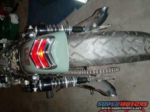 motorcycle rear fender with chevron taillight and exposed chain drive