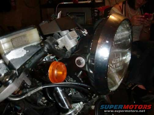 Motorcycle headlight and orange turn signal