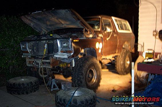 1978 Ford Bronco with hood open, front end disassembled, and large tires