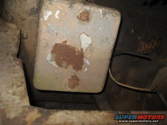 Underbody part with rust and peeling paint