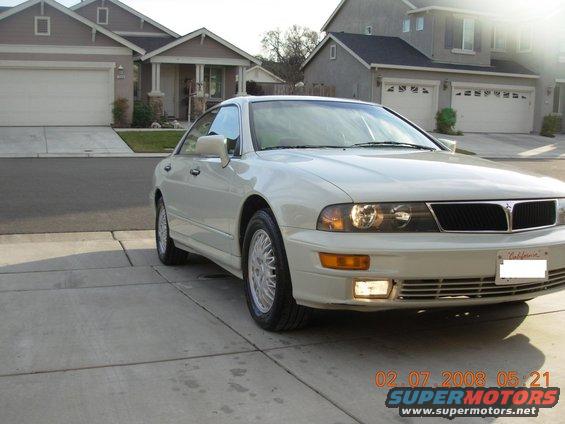 1999 Mitsubishi Diamante parked in front of a suburban house