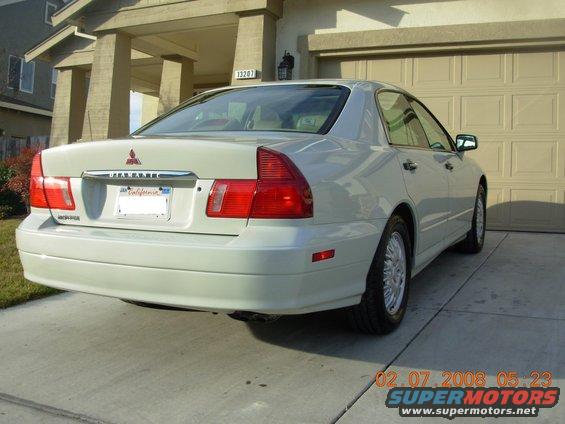 Rear view of a 1999 Mitsubishi Diamante sedan, light color