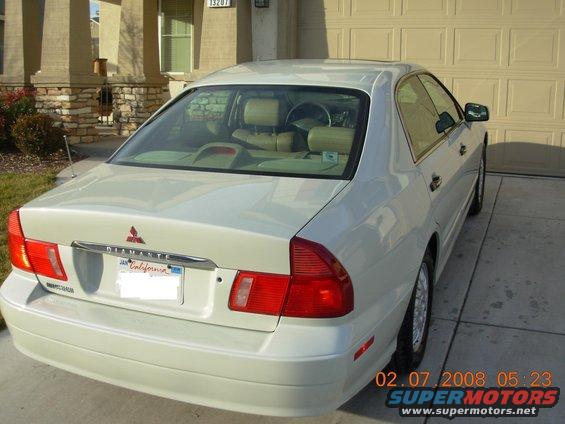1999 Mitsubishi Diamante sedan parked in driveway, rear view. California license plate visible