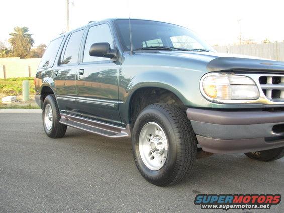 1997 Ford Explorer SUV, green, parked on asphalt