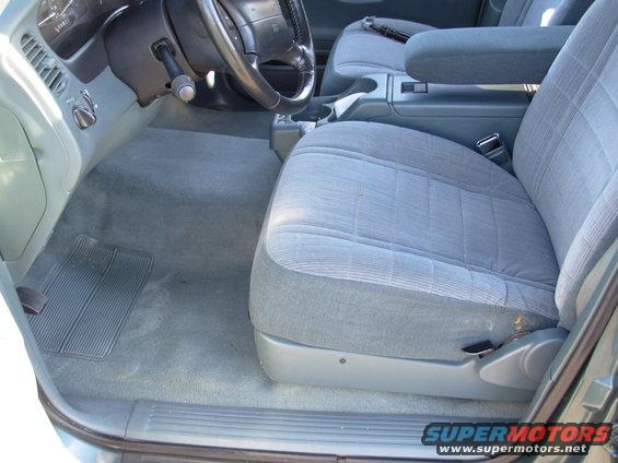 Interior of a 1997 Ford Explorer, showing the driver's seat, dashboard, and center console