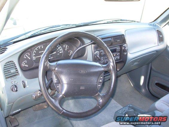 Interior view of 1997 Ford Explorer dashboard with steering wheel and gauges