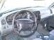 1997 Ford Explorer - The interior of a 1997 Ford Explorer, showing the dashboard, steering wheel, and center console.