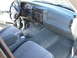 1997 Ford Explorer - The interior of a 1997 Ford Explorer is visible, gray cloth seats and a full dashboard.