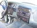 1997 Ford Explorer - The interior of a 1997 Ford Explorer shows the dashboard, steering wheel, and center console with radio and climate controls.