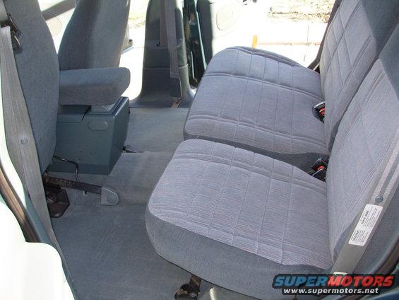 1997 Ford Explorer interior showing front seats, rear bench seat, and center console