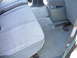1997 Ford Explorer - The interior of the vehicle shows the rear seating area and the center console with its storage compartment.