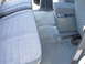 1997 Ford Explorer - The interior of a 1997 Ford Explorer shows blue patterned seats and a center console.