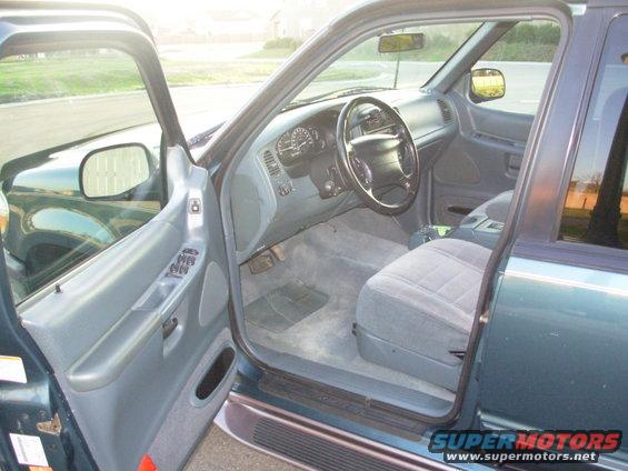 Interior of a 1997 Ford Explorer showing dashboard, steering wheel, and seats