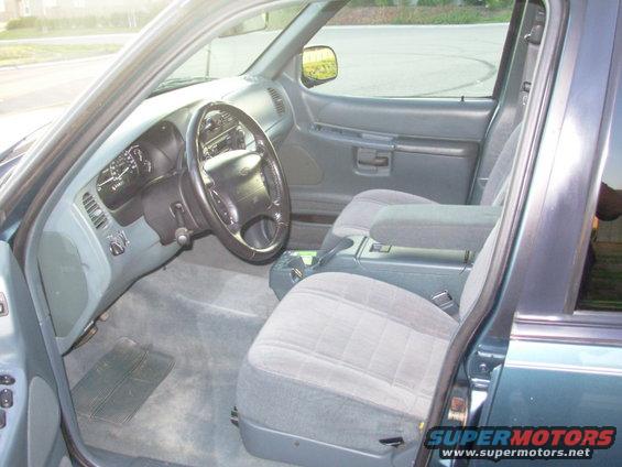 1997 Ford Explorer interior showing front seats, dashboard, and steering wheel