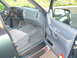 1997 Ford Explorer - The interior of a 1997 Ford Explorer, the dashboard, driver's seat, and door panel.
