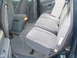 1997 Ford Explorer - The interior of a vehicle shows the rear seating area and a center console between the front seats.