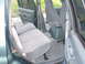 1997 Ford Explorer - The interior of a 1997 Ford Explorer shows grey cloth seats and a center console.