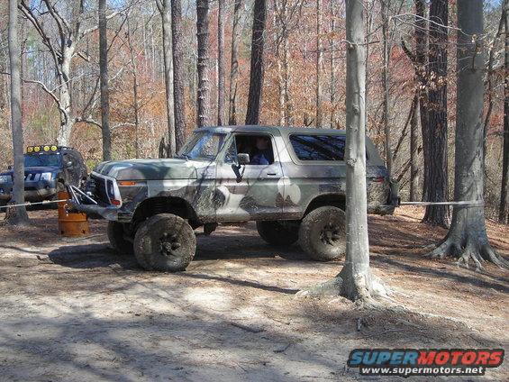 Camouflaged 1978 Ford Bronco with lifted suspension and off-road tires