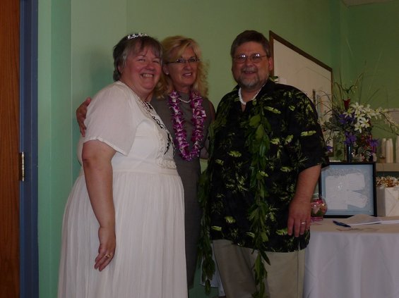 Three people posing for a photo indoors