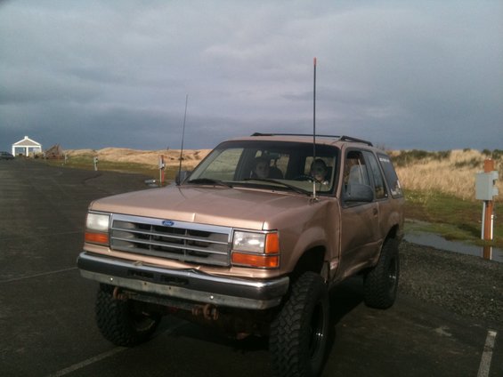 Tan 1995 Ford Explorer, lifted, 3q-front view