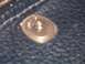 1973 Ford Ranchero - A metal snap fastener is visible on a dark, textured material.