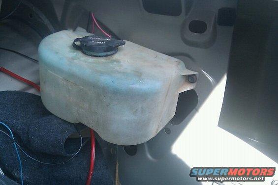Windshield washer fluid reservoir with black cap