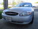 2003 Ford Taurus - Front view of a silver 2003 Ford Taurus parked in a driveway.