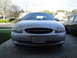 2003 Ford Taurus - The front grille and headlights of a silver Ford Taurus are visible in this photo.