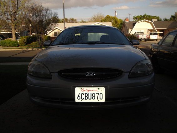 Silver sedan front view with California license plate 6CBU870