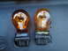 2003 Ford Taurus - A comparison of a new Sylvania amber bulb next to a damaged one covered in debris.