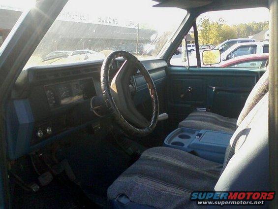 Interior view of 1983 Ford Bronco, showing dashboard, steering wheel, and seats