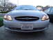 2003 Ford Taurus - The front grille and headlight design confirm this is a 2003 Ford Taurus.