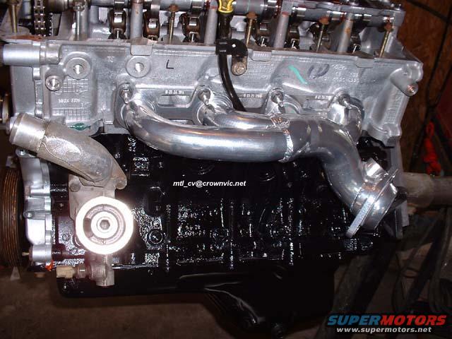 Left head on the freshly painted block. New shorty headers. 