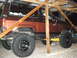 1986 Ford Bronco II - This 1986 Ford Bronco II is shown from the side, parked under a rustic shelter.