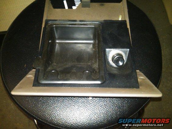 Interior car part showing ashtray and cigarette lighter assembly