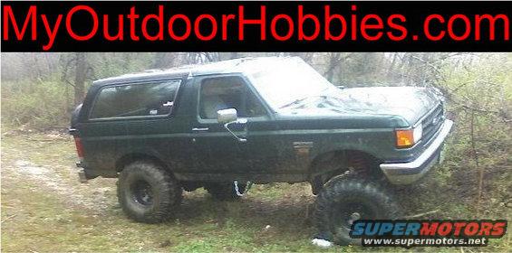 1989 Ford Bronco parked off-road with large tires