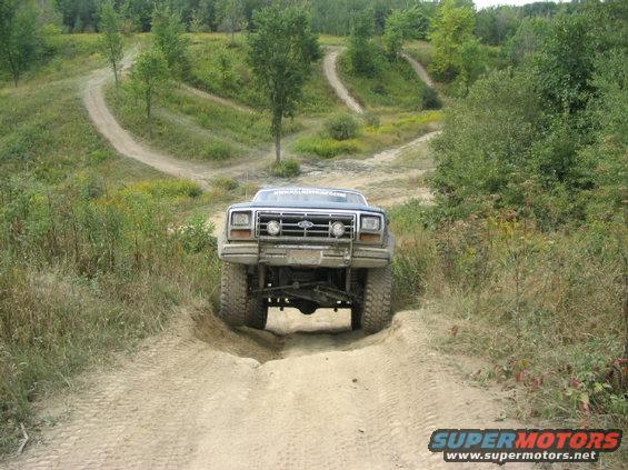 Ford F-Series truck going off-road on a dirt track