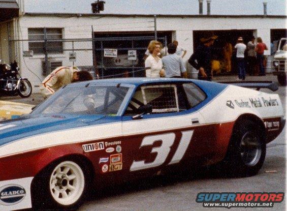 Race car number 31 with red, white, and blue livery