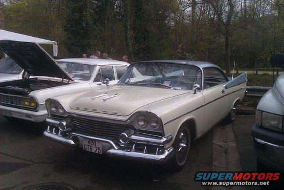 1957 Dodge Custom Royal two-tone coupe with chrome grille and fins. License plate reads 431 GTR 75