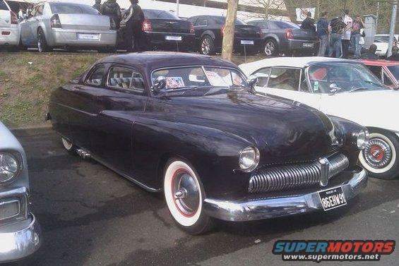 1950 Mercury Eight Coupe with wide whitewall tires and chrome grille