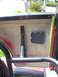1992 Ford Ranger - Close-up of a vehicle's interior door panel, showing a roll cage and a carbon fiber insert.