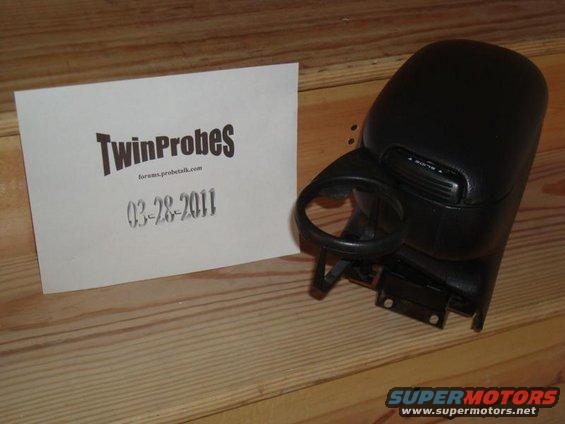 Car armrest with cup holder and a card that says TwinProbes and 03-28-2011